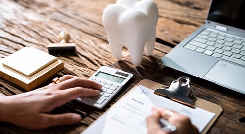 Patient in Santa Fe budgeting for cosmetic dentistry