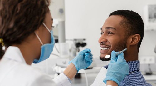 Patient in Santa Fe talking to dentist about cosmetic dentistry