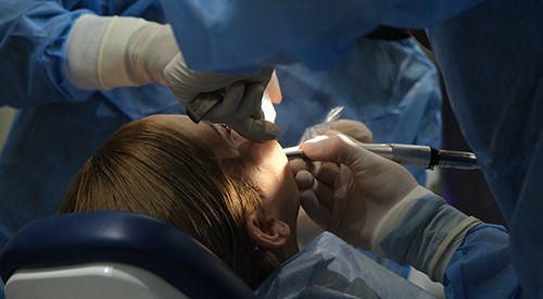 Patient undergoing dental implant surgery