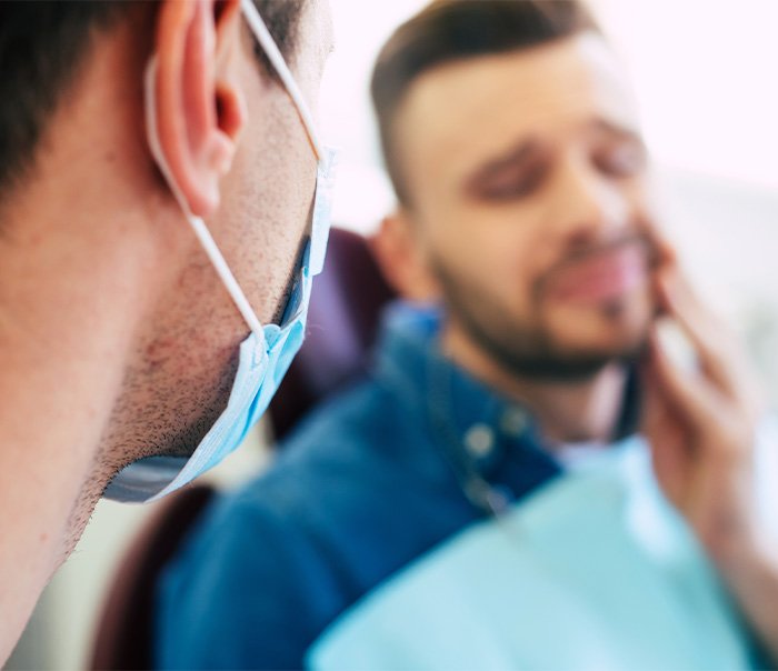 Patient with toothache at dentist's office