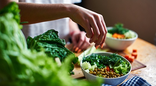 Patient preparing healthy meal in kitchen