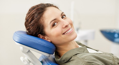 Woman smiling while relaxing in treatment chair